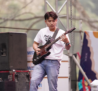 Student learning film-making with camera