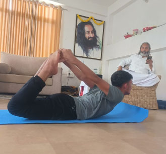 Student playing guitar on stage