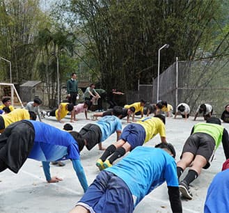 Student practicing yoga indoors